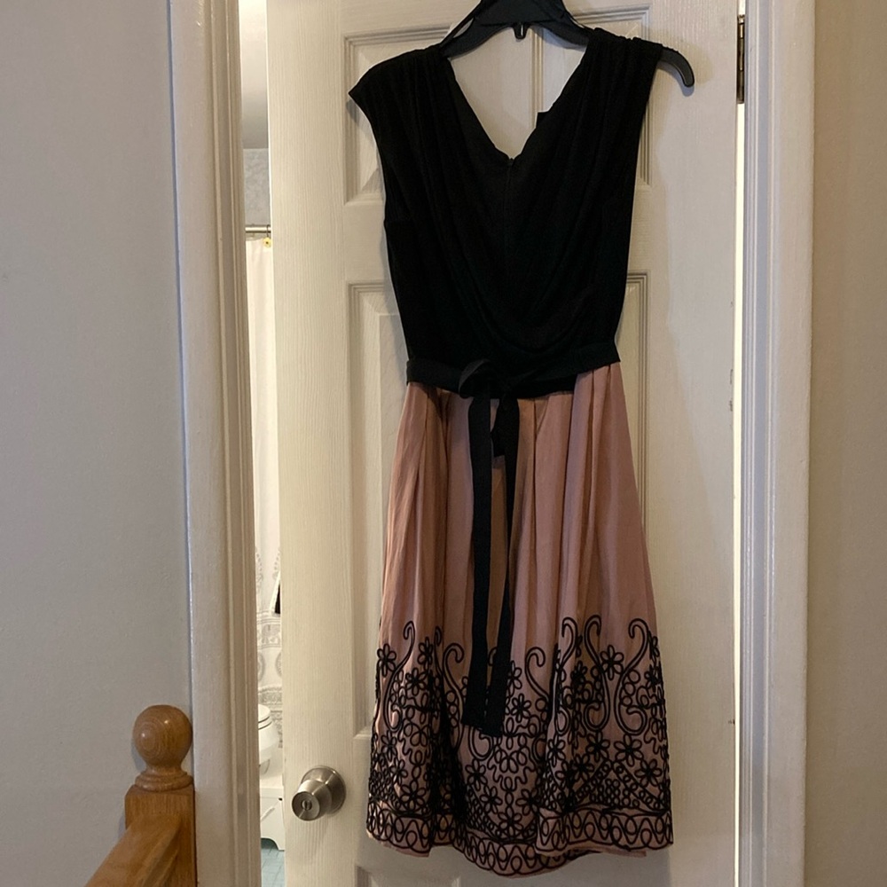 Black and muted pink A line dress with black embroidery effect at hem